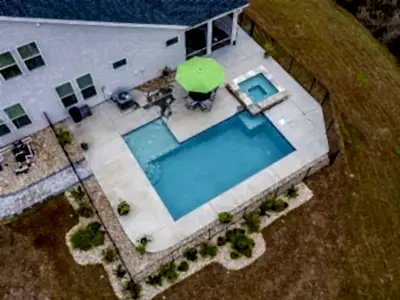 Lux Project 13 custom L shaped pool with spa