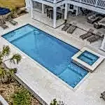 Lux Project 9 featuring a custom rectangular pool and spa