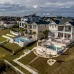 Lux Project 8 custom pool and spa situated in an urban setting beside a serene lake