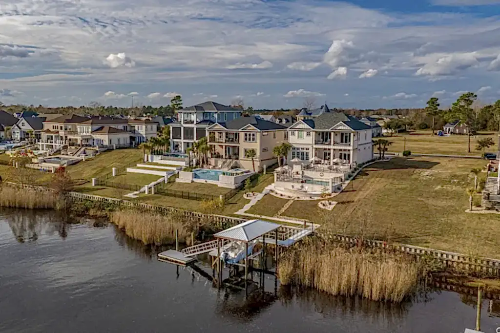 Lux Project 8 custom pool and spa situated in an urban setting beside a serene lake