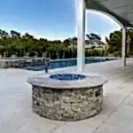 Lux Project 7 custom fireplace beside pool and spa