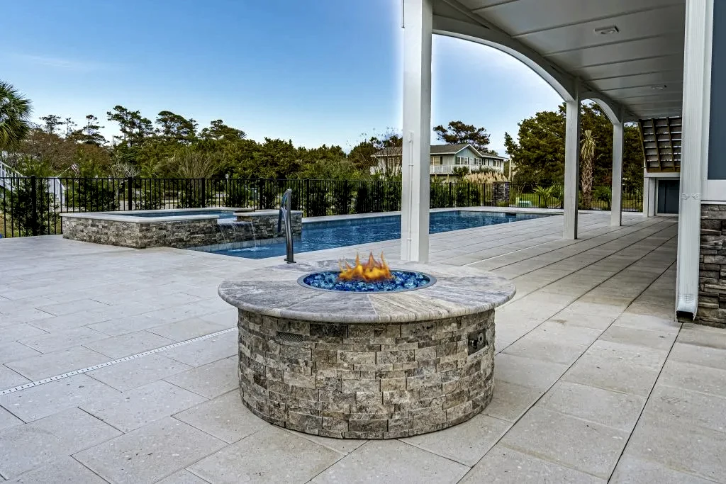 Lux Project 7 custom fireplace beside pool and spa
